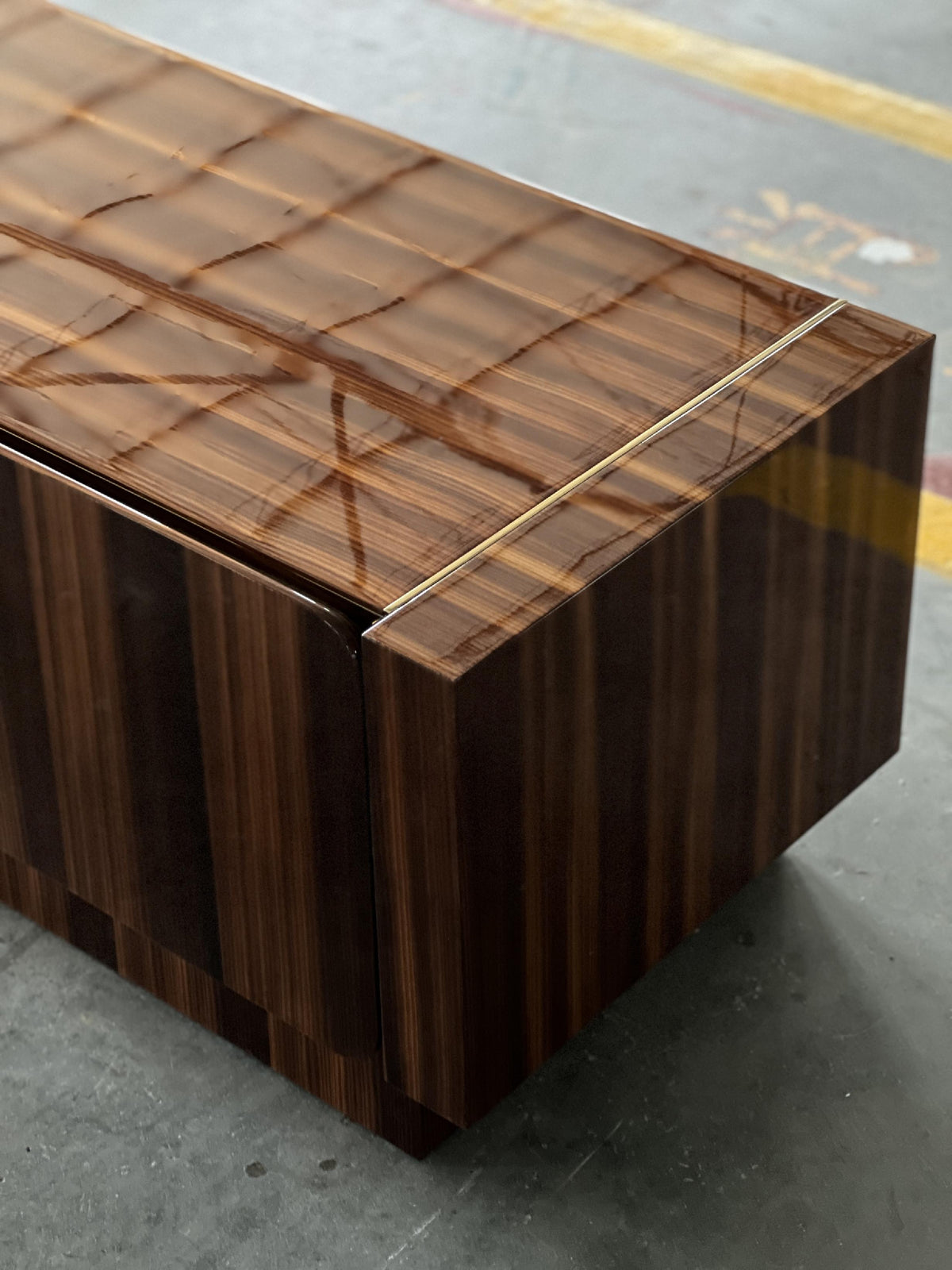 Close detail of a wood-grain finish with metal inlay