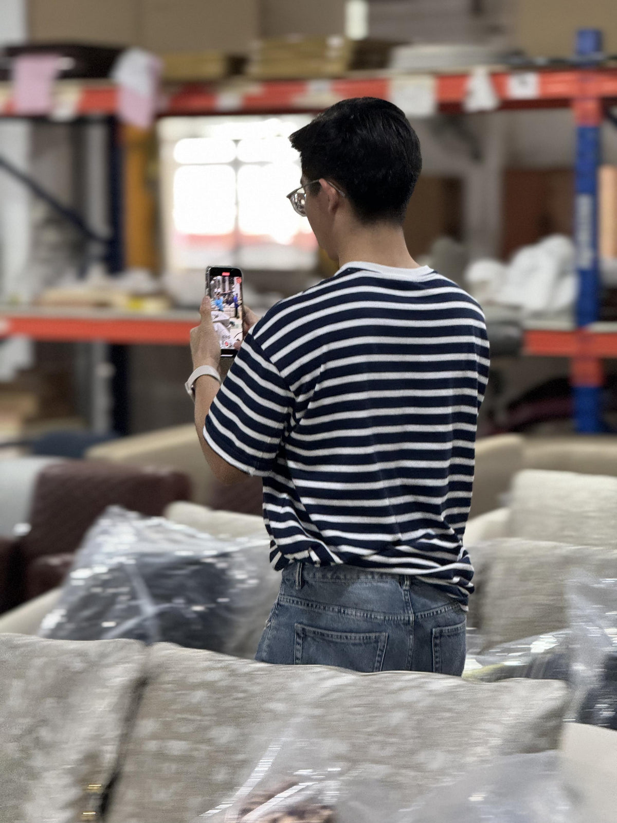 Protected furniture being photographed on a factory floor