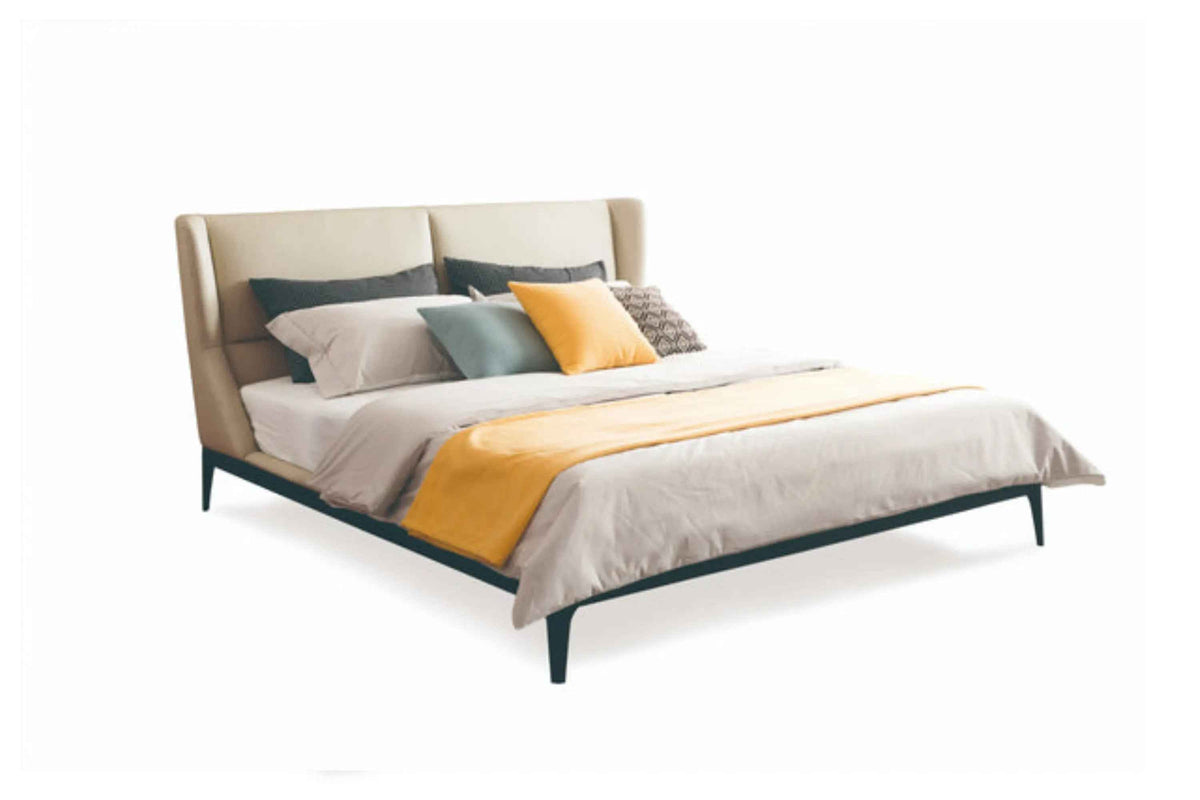 VX1-1695-1 bed with a light-colored headboard, dark frame and raised legs against a white background