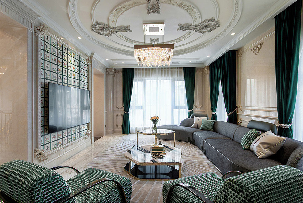 Cropped project view of the curved grey sofa, cushions and green patterned lounge seating